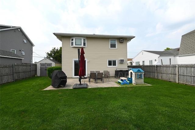 184 Sumpwams Ave, Babylon, NY 11702 - back of house featuring a patio, a fenced backyard, a storage shed, and a wall mounted air conditioner