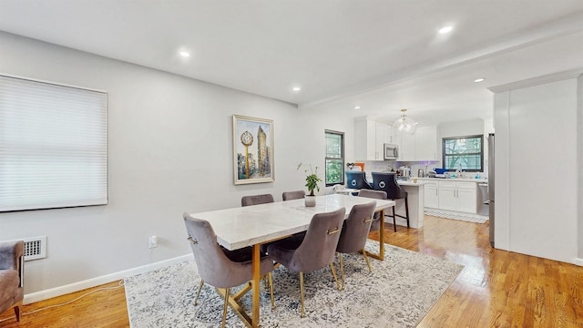 17 Arthur Pl, Yonkers, NY 10701 - dining room with light wood-style flooring and recessed lighting