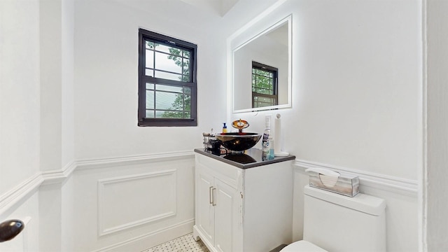 17 Arthur Pl, Yonkers, NY 10701 - bathroom featuring vanity and a wainscoted wall