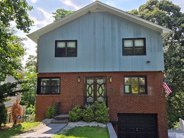 17 Arthur Pl, Yonkers, NY 10701 - view of front of property featuring brick siding and an attached garage