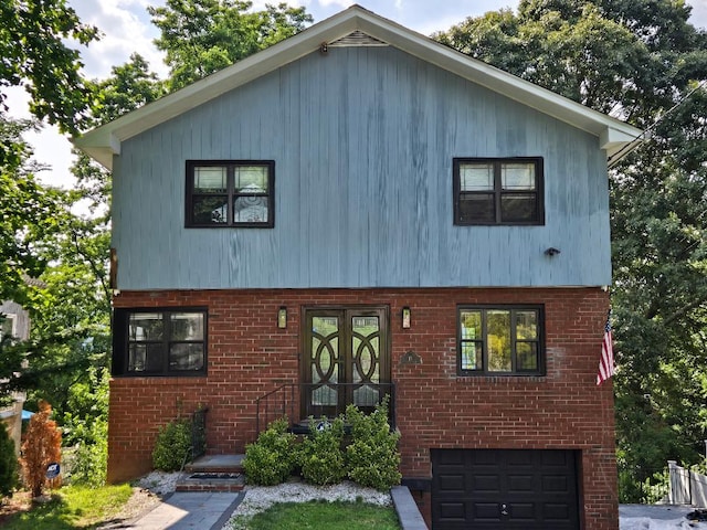 17 Arthur Pl, Yonkers, NY 10701 - view of front of home featuring a garage and brick siding
