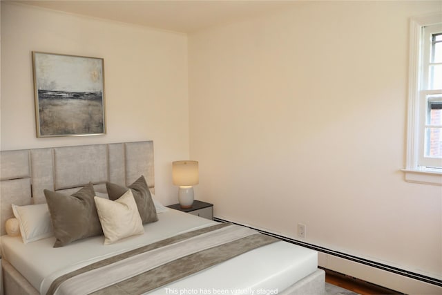 19 Edna Dr, Syosset, NY 11791 - bedroom featuring a baseboard heating unit and multiple windows