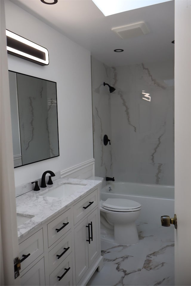19 Edna Dr, Syosset, NY 11791 - bathroom with marble finish floors, double vanity, tub / shower combination, and a wainscoted wall