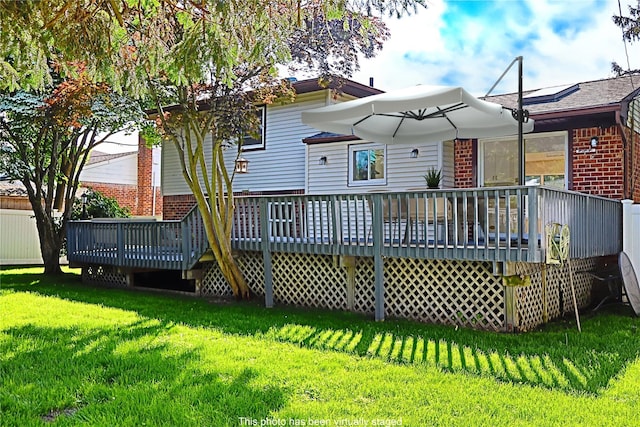 19 Edna Dr, Syosset, NY 11791 - back of property with brick siding, a deck, and a yard