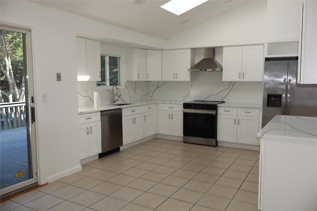 19 Edna Dr, Syosset, NY 11791 - kitchen with stainless steel appliances, wall chimney range hood, backsplash, lofted ceiling, and a skylight