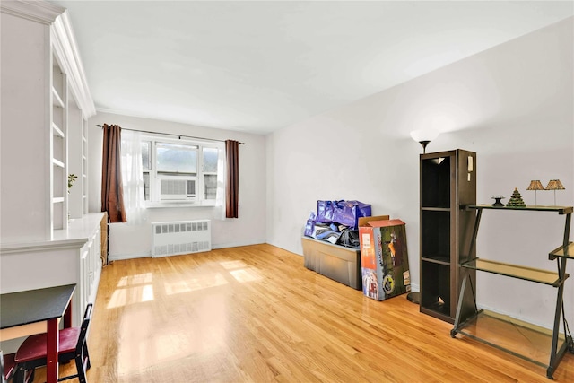 29-49 137th St Unit 2H, Flushing, NY 11354 - interior space with radiator, light wood-type flooring, and cooling unit