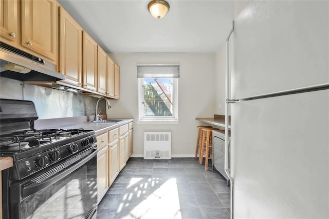 29-49 137th St Unit 2H, Flushing, NY 11354 - kitchen featuring freestanding refrigerator, gas stove, exhaust hood, tile patterned floors, and light brown cabinets