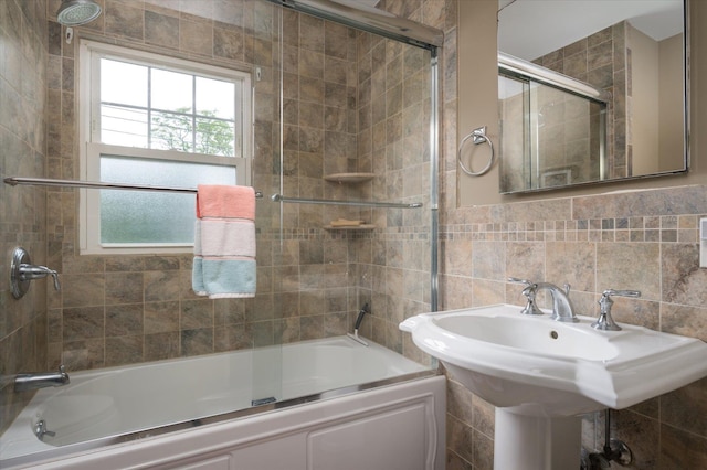 3665 Lufberry Ave, Wantagh, NY 11793 - bathroom featuring combined bath / shower with glass door and tile walls
