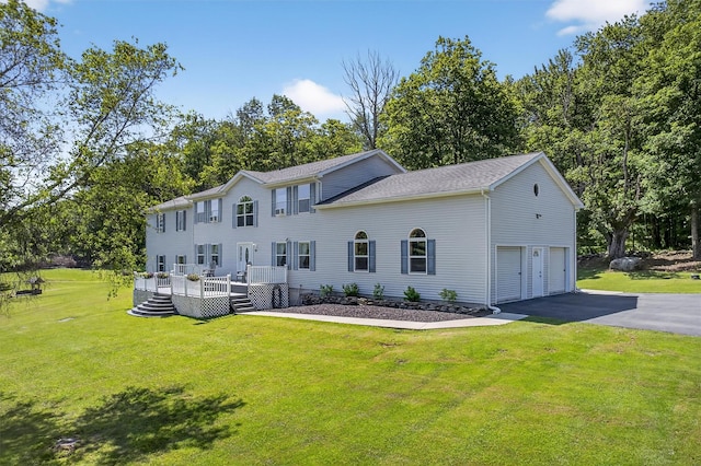 97 Pittaluga Dr, Monticello, NY 12701 - back of property with driveway, a wooden deck, a yard, and view of scattered trees