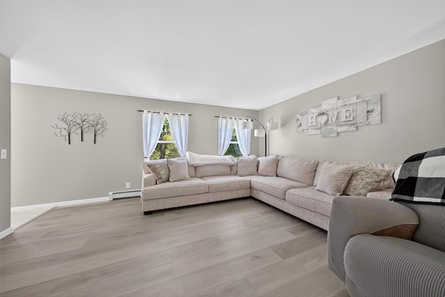 97 Pittaluga Dr, Monticello, NY 12701 - living room featuring a baseboard radiator and light wood finished floors