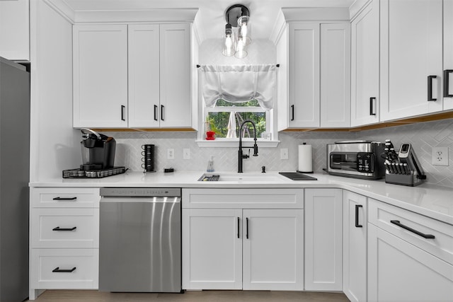 97 Pittaluga Dr, Monticello, NY 12701 - kitchen featuring appliances with stainless steel finishes, backsplash, white cabinets, and light countertops