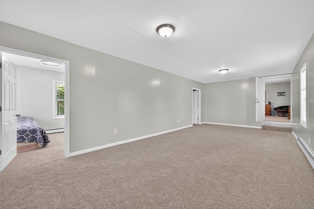 97 Pittaluga Dr, Monticello, NY 12701 - carpeted empty room featuring a baseboard radiator and baseboards