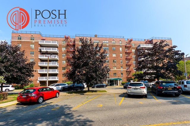 86-10 151st Unit 6B, Howard Beach, NY 11411 - view of apartment building / complex featuring uncovered parking