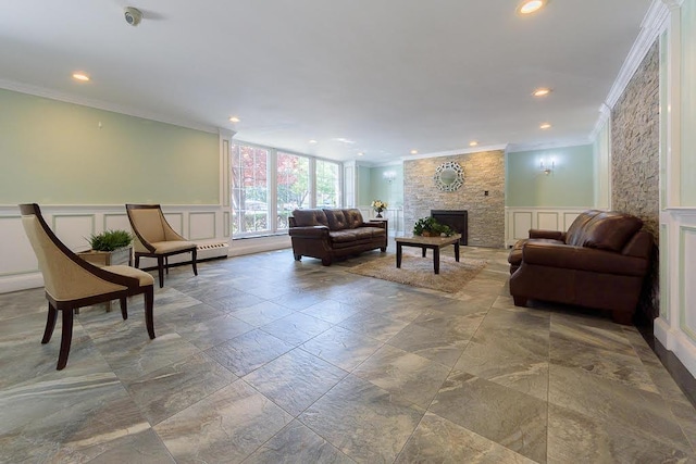 86-10 151st Unit 6B, Howard Beach, NY 11411 - living area with crown molding, a decorative wall, a fireplace, recessed lighting, and a wainscoted wall