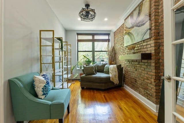 100 Ralph Ave Unit 2L, Brooklyn, NY 11221 - living area featuring brick wall, wood finished floors, and recessed lighting