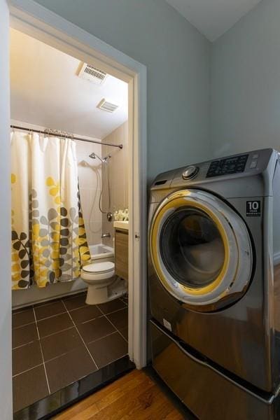 100 Ralph Ave Unit 2L, Brooklyn, NY 11221 - washroom featuring washer / dryer and wood finished floors