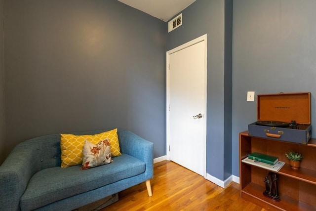 100 Ralph Ave Unit 2L, Brooklyn, NY 11221 - sitting room with wood finished floors and baseboards
