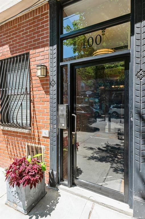 100 Ralph Ave Unit 2L, Brooklyn, NY 11221 - property entrance featuring brick siding