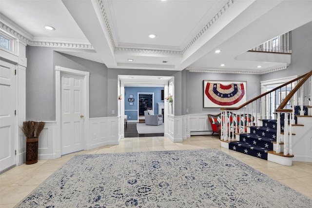 8 Danton Ln S, Locust Valley, NY 11560 - tiled entrance foyer with crown molding, stairs, recessed lighting, a decorative wall, and baseboard heating