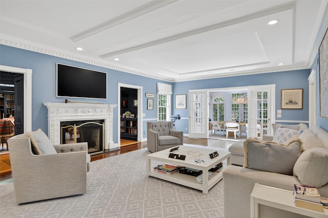 8 Danton Ln S, Locust Valley, NY 11560 - living room with french doors, a raised ceiling, a fireplace, recessed lighting, and crown molding