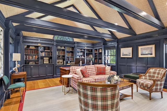 8 Danton Ln S, Locust Valley, NY 11560 - living area featuring a decorative wall, wood finished floors, beamed ceiling, and high vaulted ceiling