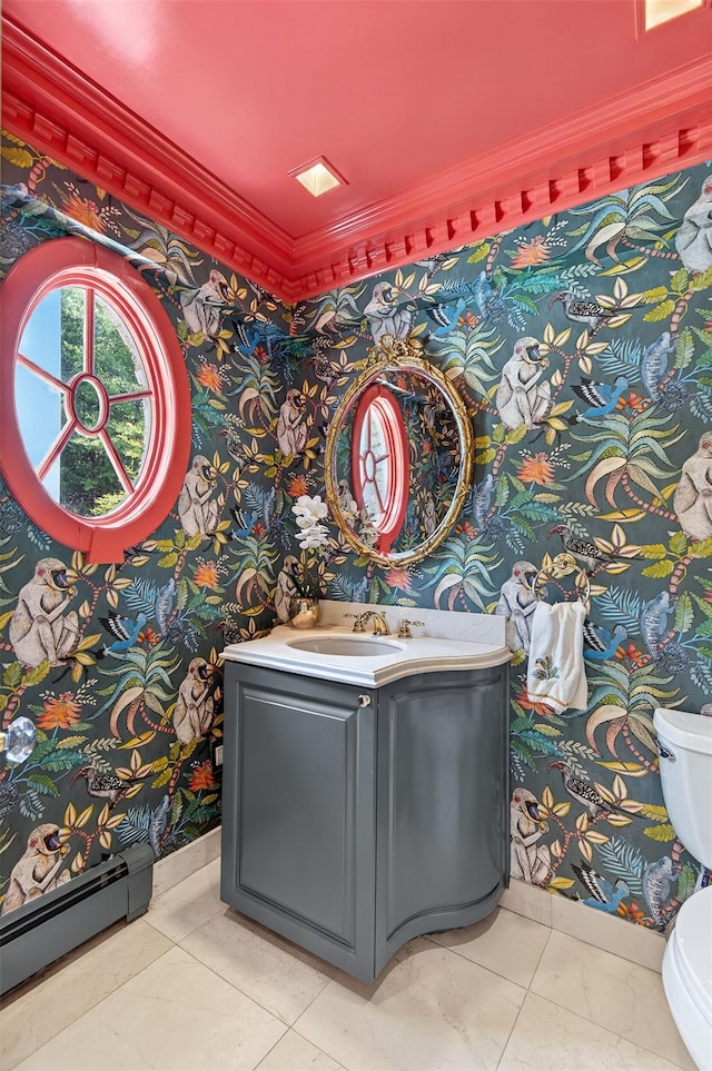 8 Danton Ln S, Locust Valley, NY 11560 - bathroom with wallpapered walls, baseboard heating, vanity, and crown molding