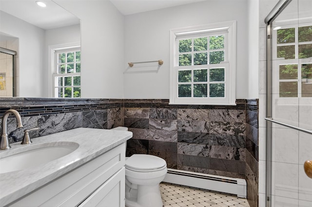 8 Danton Ln S, Locust Valley, NY 11560 - full bath featuring a baseboard radiator, tile walls, vanity, a shower stall, and wainscoting