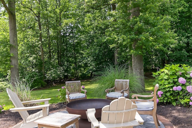 8 Danton Ln S, Locust Valley, NY 11560 - view of patio featuring a fire pit