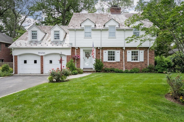 38 Mason Dr, Manhasset, NY 11030 - view of front facade with asphalt driveway, a chimney, brick siding, and a front yard