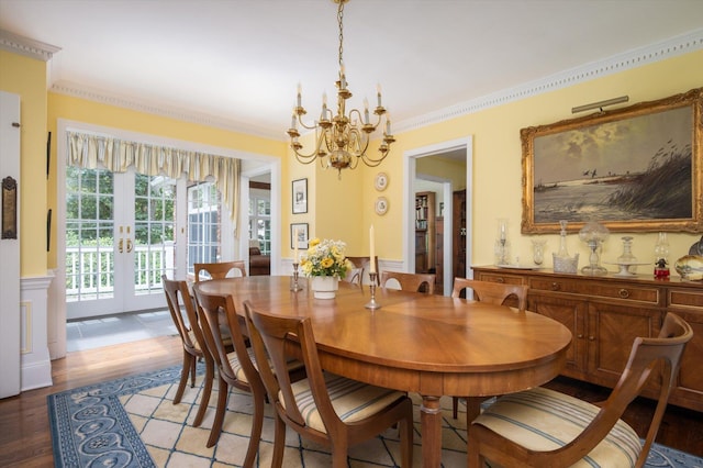 38 Mason Dr, Manhasset, NY 11030 - dining room with french doors, a wainscoted wall, a chandelier, light wood-style floors, and ornamental molding