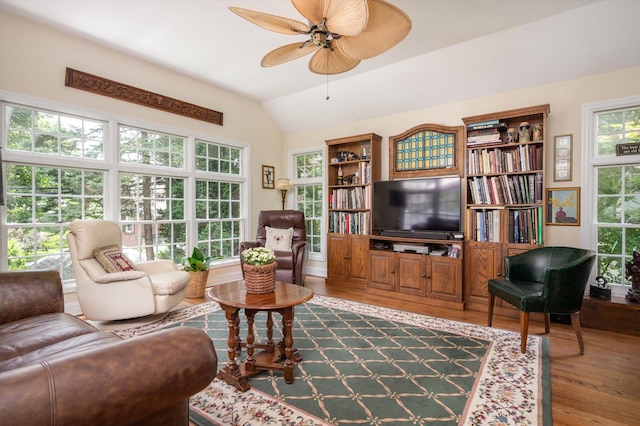 38 Mason Dr, Manhasset, NY 11030 - living area with dark wood-type flooring, vaulted ceiling, and a ceiling fan