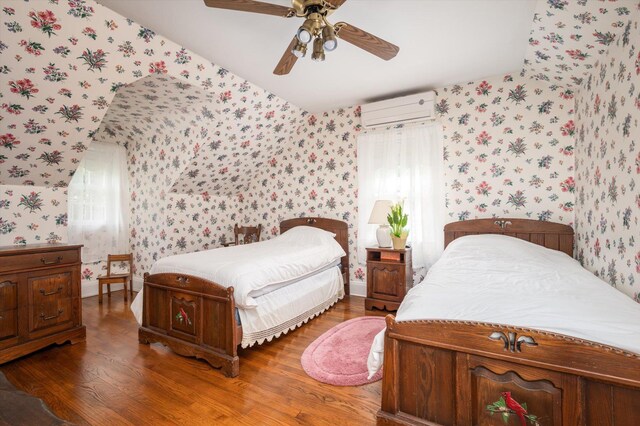 38 Mason Dr, Manhasset, NY 11030 - bedroom featuring wallpapered walls, a wall mounted AC, wood finished floors, and multiple windows