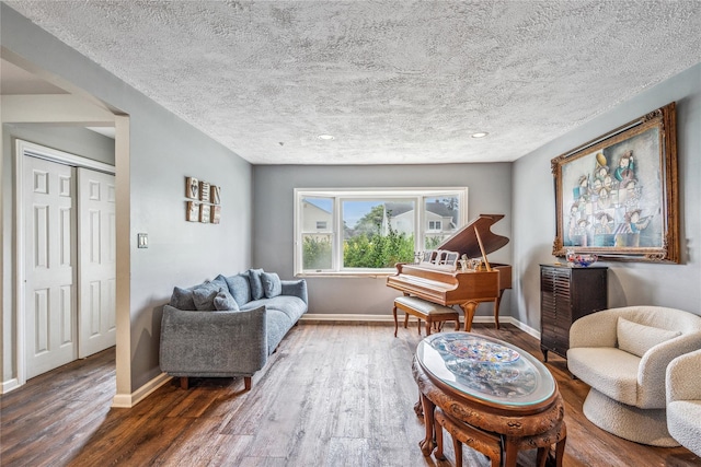 58 Circle Dr, Syosset, NY 11791 - living room featuring wood finished floors, a textured ceiling, and recessed lighting