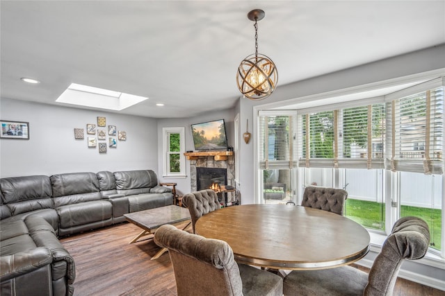 58 Circle Dr, Syosset, NY 11791 - dining room featuring a skylight, a stone fireplace, plenty of natural light, and recessed lighting