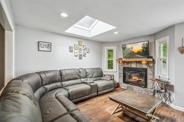 58 Circle Dr, Syosset, NY 11791 - living room with a skylight, wood finished floors, a fireplace, and recessed lighting