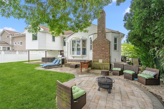 58 Circle Dr, Syosset, NY 11791 - back of property with a patio, a chimney, and an outdoor living space with a fire pit