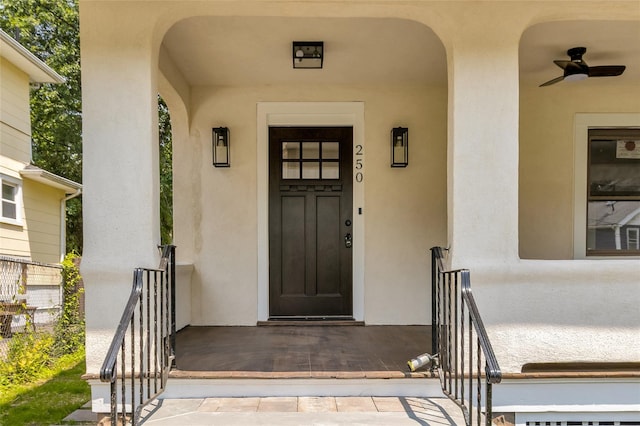 250 Cedar Hill Ave, Nyack, NY 10960 - doorway to property with stucco siding and a ceiling fan