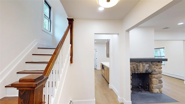 250 Cedar Hill Ave, Nyack, NY 10960 - stairway featuring wood finished floors, a baseboard heating unit, healthy amount of natural light, and recessed lighting