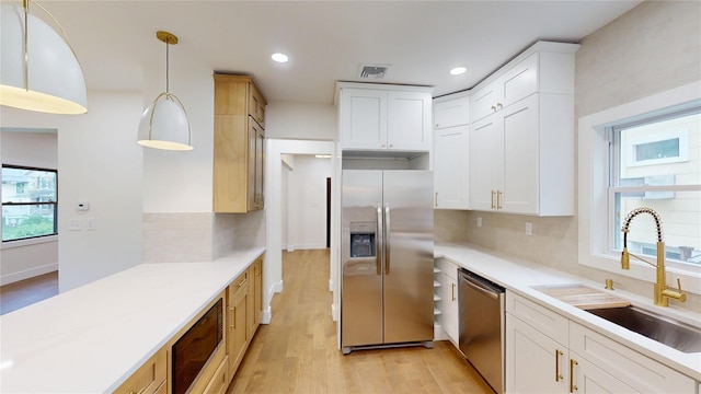 250 Cedar Hill Ave, Nyack, NY 10960 - kitchen featuring stainless steel appliances, light wood-type flooring, backsplash, light countertops, and recessed lighting