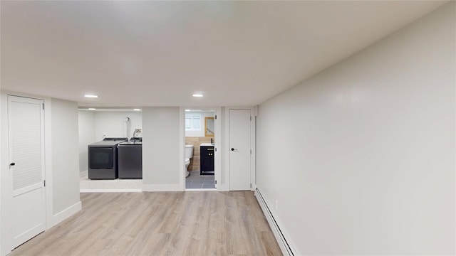 250 Cedar Hill Ave, Nyack, NY 10960 - unfurnished living room with washer and dryer, light wood-style floors, recessed lighting, and a baseboard heating unit