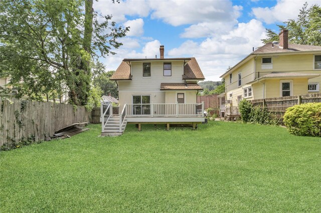 250 Cedar Hill Ave, Nyack, NY 10960 - back of property featuring a chimney, a fenced backyard, a wooden deck, and a shingled roof