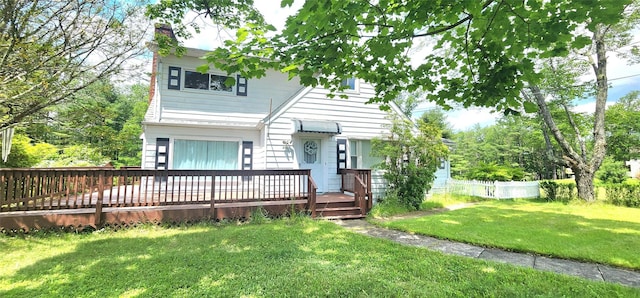 530 Sackett Lake Rd, Monticello, NY 12701 - view of front of house featuring a chimney and a wooden deck