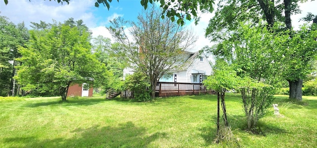 530 Sackett Lake Rd, Monticello, NY 12701 - view of green lawn with a wooden deck and an outbuilding