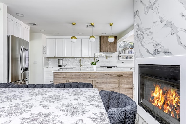 17 Onderdonk Rd, Suffern, NY 10901 - kitchen featuring smart refrigerator, tasteful backsplash, light stone countertops, and white cabinetry