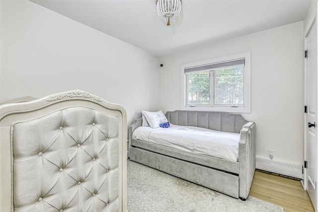 17 Onderdonk Rd, Suffern, NY 10901 - bedroom with wood finished floors and a baseboard radiator