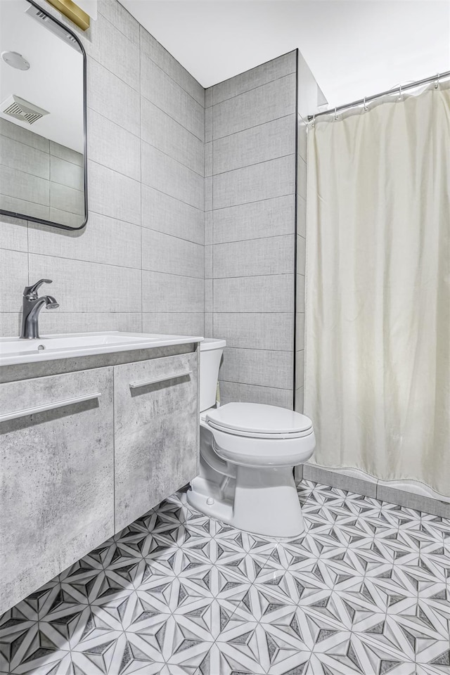 17 Onderdonk Rd, Suffern, NY 10901 - bathroom with tile walls, tile patterned floors, vanity, and a shower with curtain