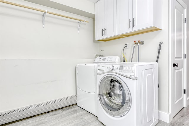 17 Onderdonk Rd, Suffern, NY 10901 - laundry area featuring cabinet space, light wood finished floors, washing machine and clothes dryer, and baseboard heating
