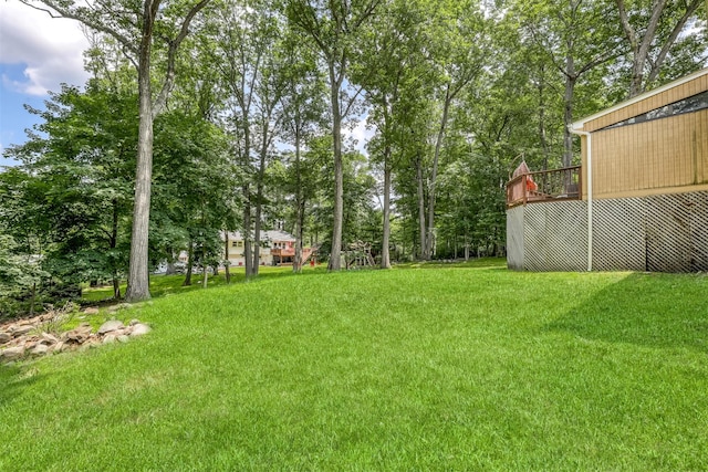 17 Onderdonk Rd, Suffern, NY 10901 - view of grassy yard featuring a wooden deck and view of scattered trees