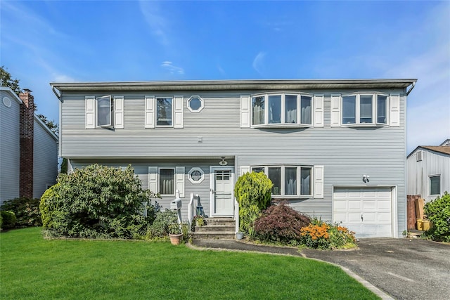 20 Wensley Rd, Plainview, NY 11803 - view of front of home with a garage, a front lawn, and driveway