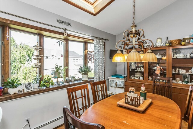 20 Wensley Rd, Plainview, NY 11803 - dining room featuring vaulted ceiling, a skylight, plenty of natural light, and a chandelier